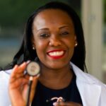 Medical professional in coat and stethoscope